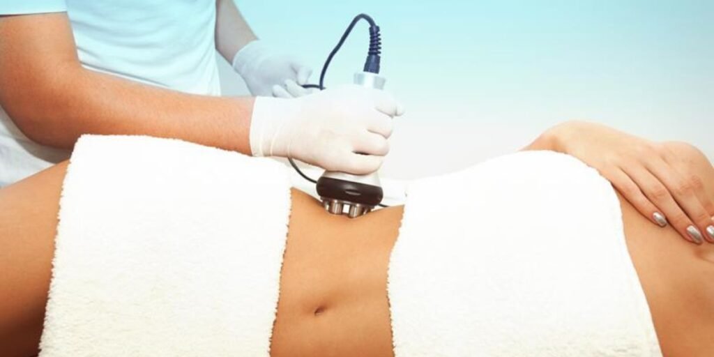 Patient receiving body contouring treatment in clinic using non-invasive device | Body Contouring Sessions