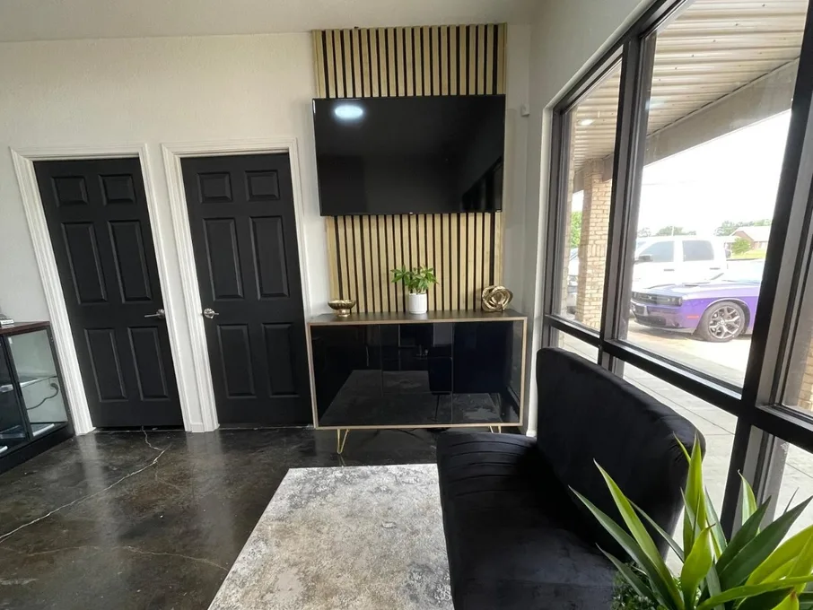 Waiting-area seating by the front window at Lux Lipo
